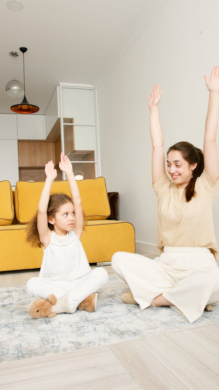 heros-img A mother and daughter enjoy a yoga session in their living room, promoting family wellness.