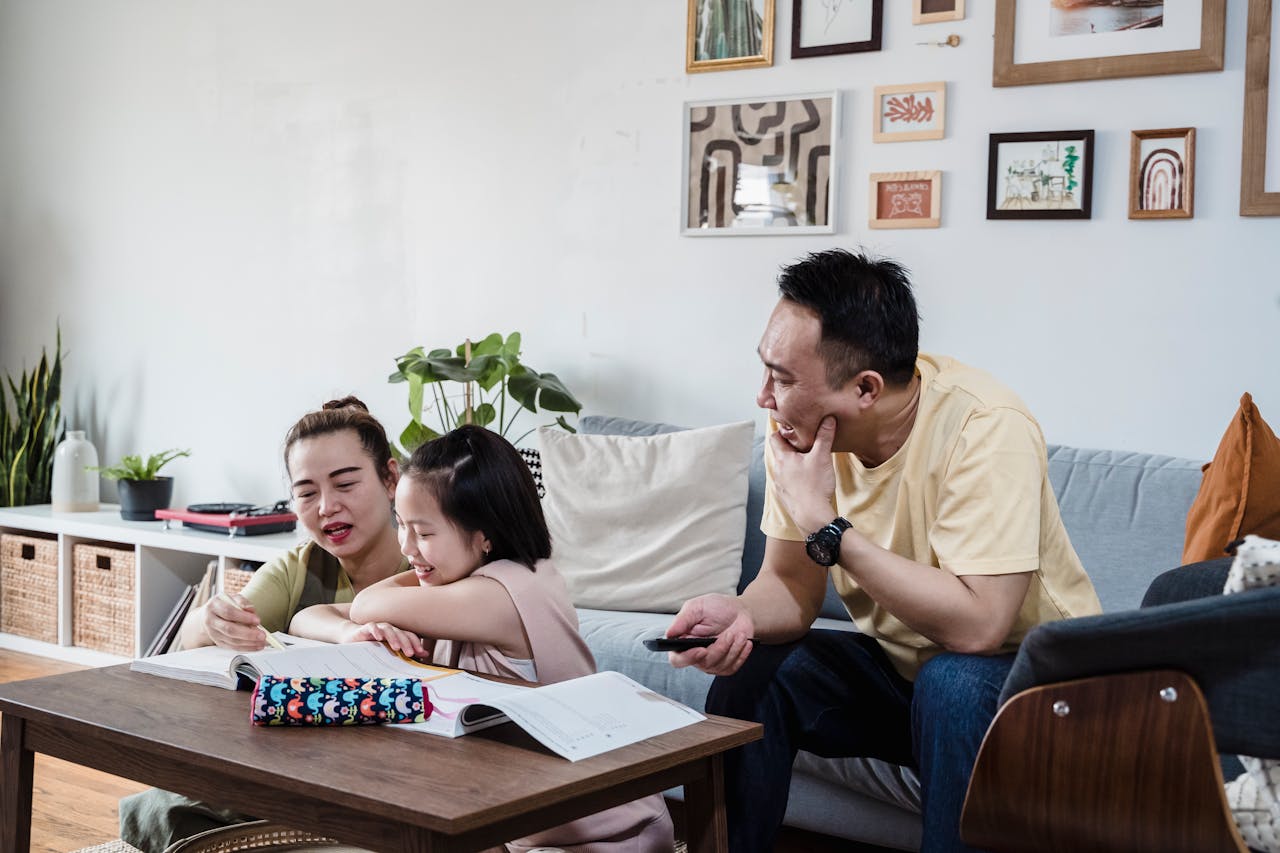 The Art of Drawing Readers In: Your attractive post title goes here A family enjoys quality time studying and writing together in their living room.